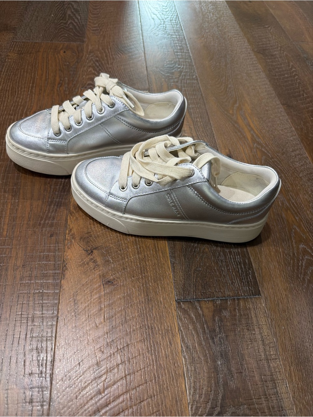 NEVER WORN Cole Haan Metallic Silver Sneakers with Cream Laces